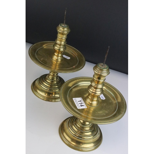 114 - Pair of Brass Gothic / Ecclesiastical Candle Prickets with circular drip trays, 29cms high