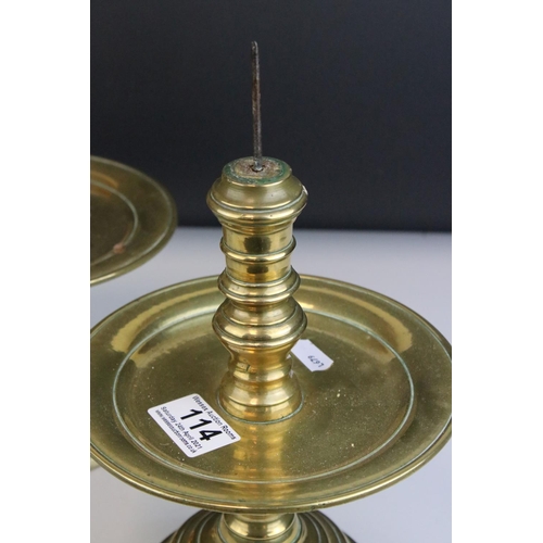 114 - Pair of Brass Gothic / Ecclesiastical Candle Prickets with circular drip trays, 29cms high