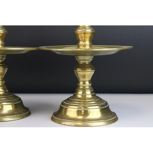 114 - Pair of Brass Gothic / Ecclesiastical Candle Prickets with circular drip trays, 29cms high