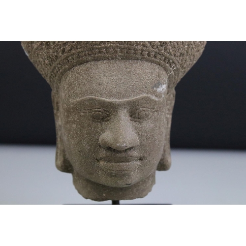 126 - Composite Stone Head in the form of an Ethnic / Atzec Man, raised on a stand, 26cms high