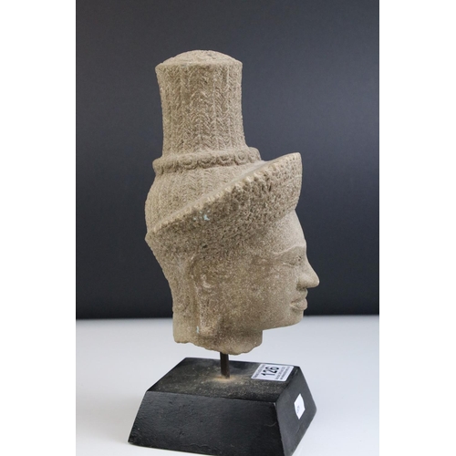 126 - Composite Stone Head in the form of an Ethnic / Atzec Man, raised on a stand, 26cms high