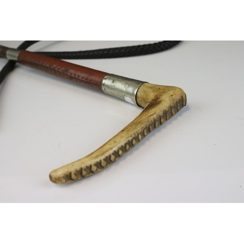 149 - Early 20th century Huntsman's Whip, the Antler Handle with Makers Button, Leather Covered Grip and L... 