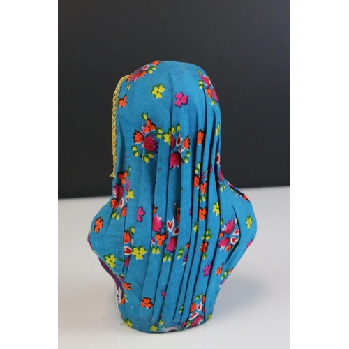 452 - A bust of an indian woman in traditional costume.