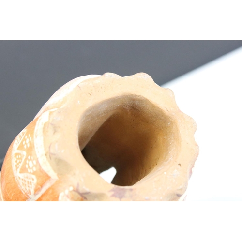 453 - A decorative pottery Peruvian ornament titled 