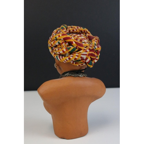 454 - A bust of an Indian man in traditional costume.