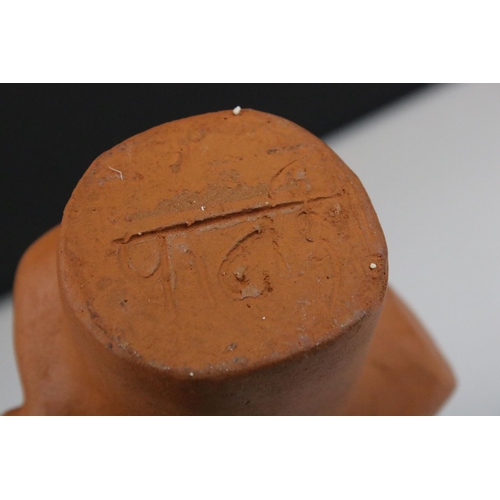 454 - A bust of an Indian man in traditional costume.