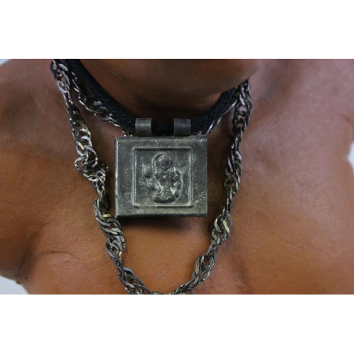 454 - A bust of an Indian man in traditional costume.