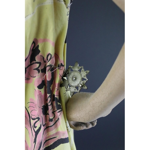 477 - A mid 20th century artist posed model of a lady in dress mounted on plinth.