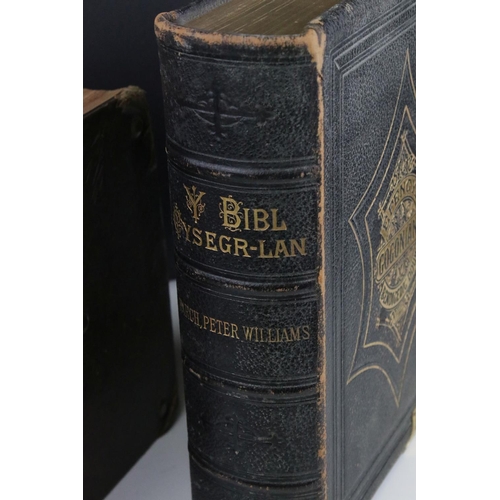 516 - Two antique welsh bibles to include a 1770 example together with a brass bound illustrated example.