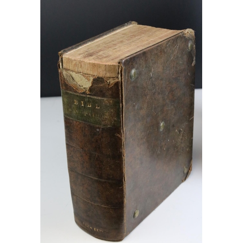 516 - Two antique welsh bibles to include a 1770 example together with a brass bound illustrated example.