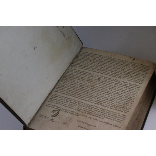 516 - Two antique welsh bibles to include a 1770 example together with a brass bound illustrated example.