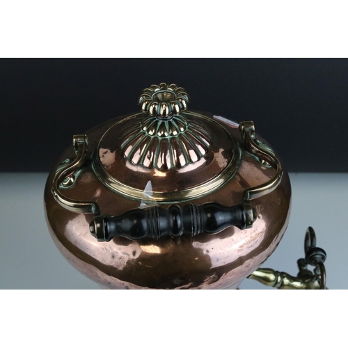 61 - 19th century Copper and Brass Tea Urn with swing ebonised handle, 39cms high