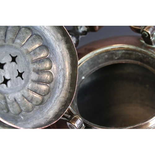 61 - 19th century Copper and Brass Tea Urn with swing ebonised handle, 39cms high