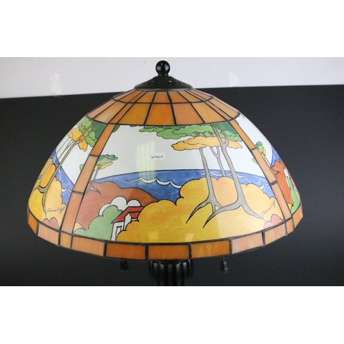 66 - Clarice Cliff printed glass lampshade, in Tiffany style, on twin bulb Corinthian style metal table l... 