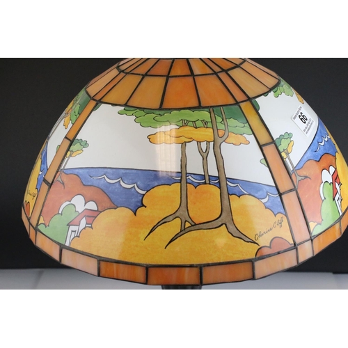 66 - Clarice Cliff printed glass lampshade, in Tiffany style, on twin bulb Corinthian style metal table l... 