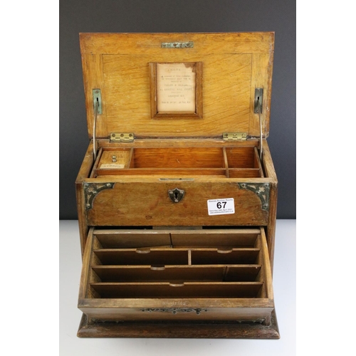 67 - Late 19th century Oak Stationery Cabinet with Brass Mounts, the rising lid with fitted interior also... 