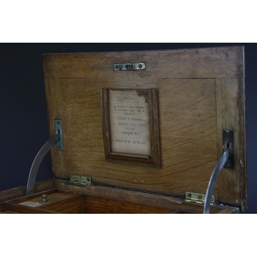 67 - Late 19th century Oak Stationery Cabinet with Brass Mounts, the rising lid with fitted interior also... 