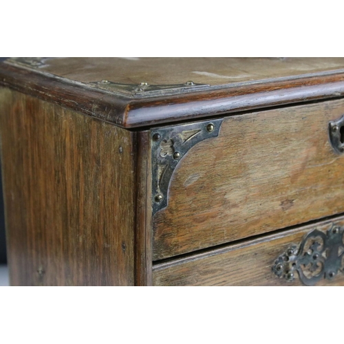 67 - Late 19th century Oak Stationery Cabinet with Brass Mounts, the rising lid with fitted interior also... 