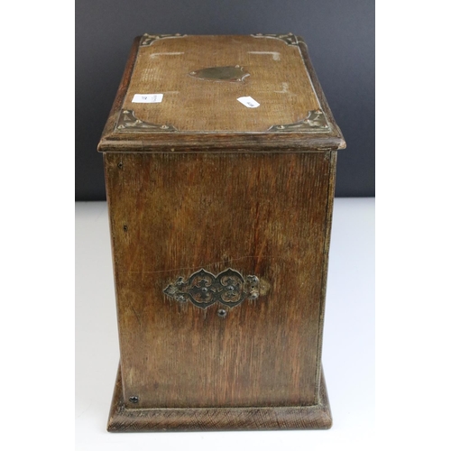 67 - Late 19th century Oak Stationery Cabinet with Brass Mounts, the rising lid with fitted interior also... 