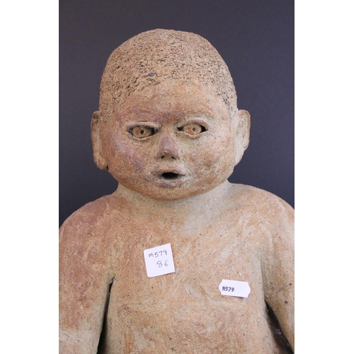 73 - Large Pottery Model of a Seated Baby, 37cms high