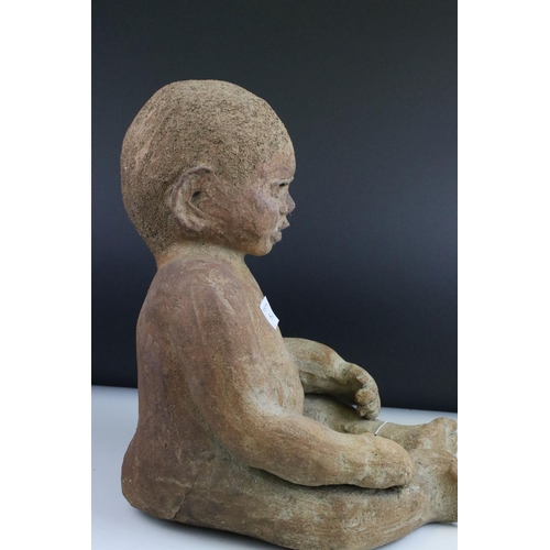 73 - Large Pottery Model of a Seated Baby, 37cms high