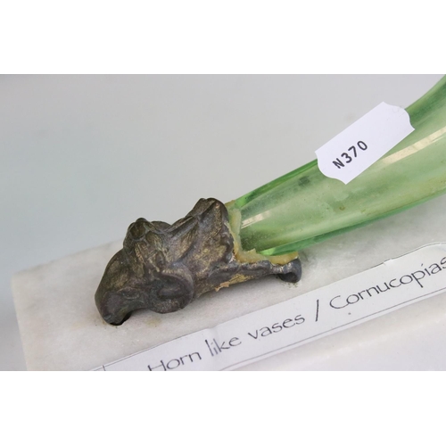 74 - Pair of Green Glass Cornucopia Vases held in Gilt Metal Rams stood on White Marble Plinths, 15cms hi... 