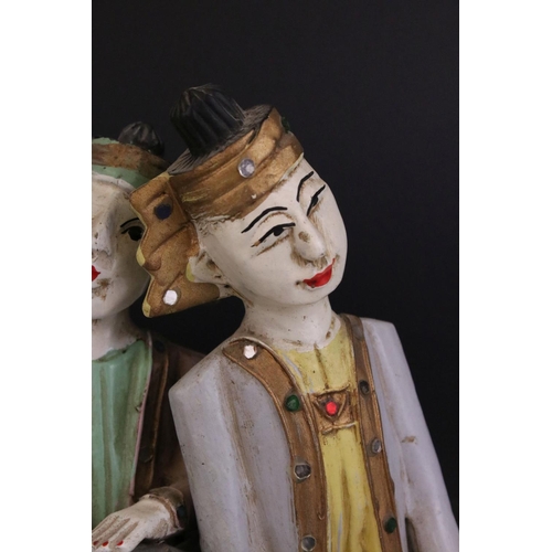 85 - Three South East Asian Painted Wooden Wall Hangings in the form of Musicians, 25cms high