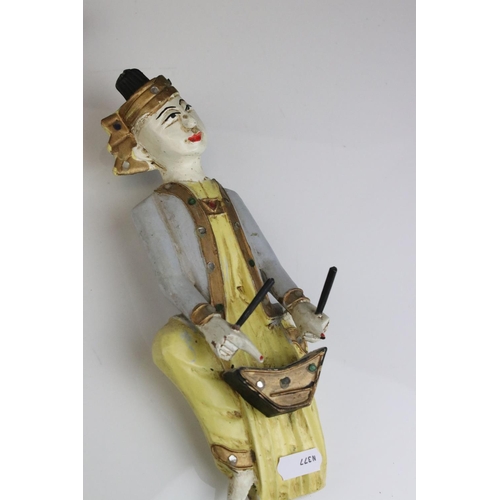 85 - Three South East Asian Painted Wooden Wall Hangings in the form of Musicians, 25cms high