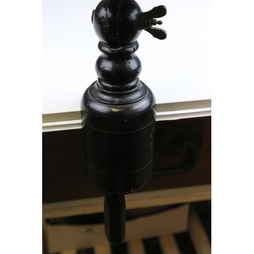 86 - Carved Wooden Man's Head mounted on a turned ebonised clamp. 53cms high