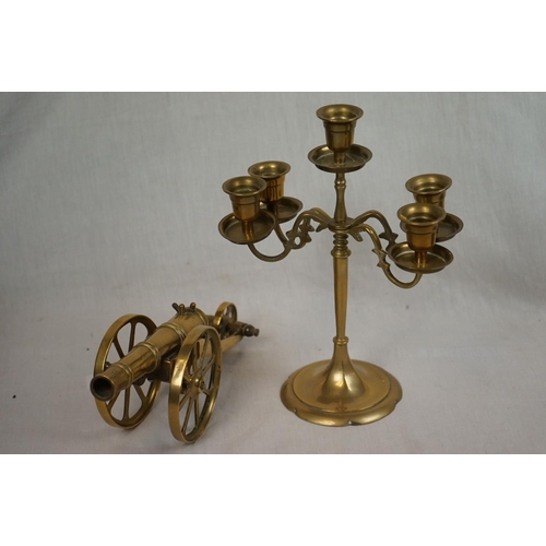 384 - A box of mixed collectables to include brass ware and african wooden carvings together with a leathe... 