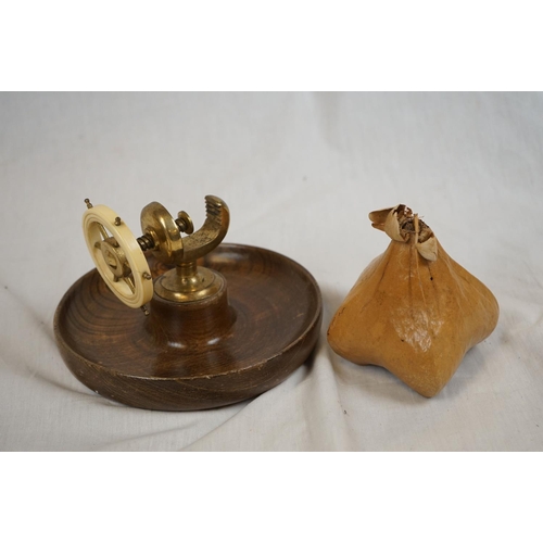 384 - A box of mixed collectables to include brass ware and african wooden carvings together with a leathe... 