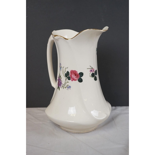 388 - A vintage ceramic wash basin and jug together with two Clarice Cliff Bizarre pattern platters.