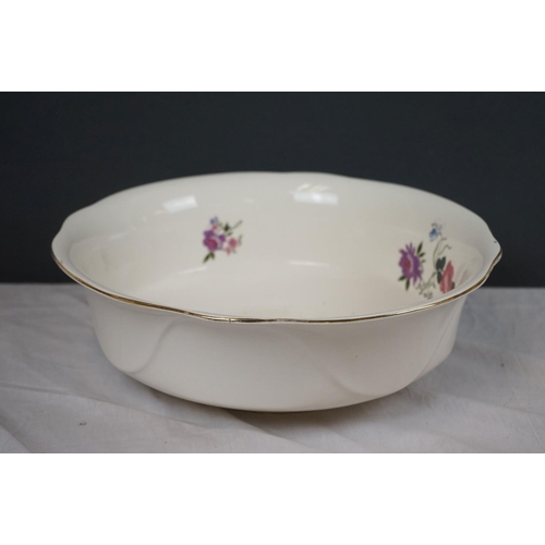 388 - A vintage ceramic wash basin and jug together with two Clarice Cliff Bizarre pattern platters.