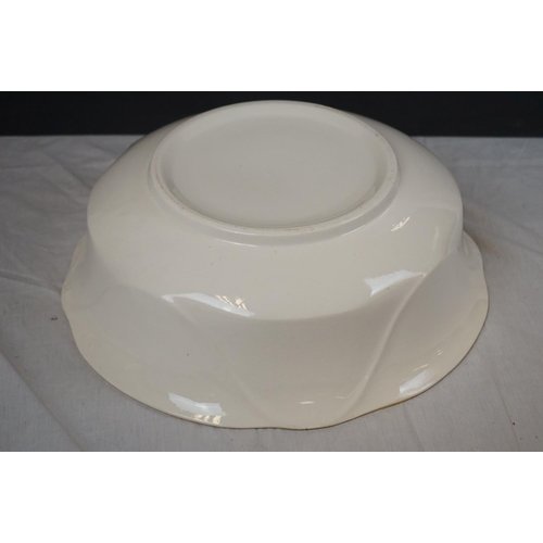 388 - A vintage ceramic wash basin and jug together with two Clarice Cliff Bizarre pattern platters.