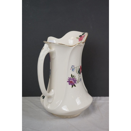 388 - A vintage ceramic wash basin and jug together with two Clarice Cliff Bizarre pattern platters.