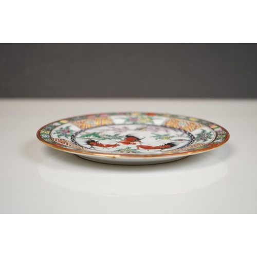 396 - Pair of Oriental hand painted ceramic plates depicting fighting cockerels