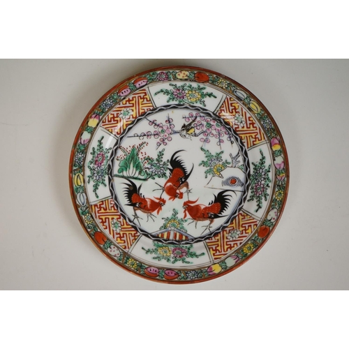 396 - Pair of Oriental hand painted ceramic plates depicting fighting cockerels