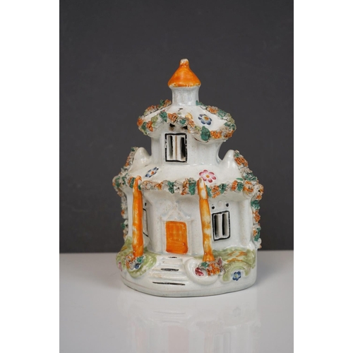 405 - Two 19th century Staffordshire Pastille Burners, two pairs of similar spill holders of sheep and swa... 