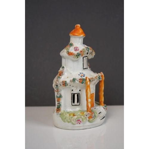 405 - Two 19th century Staffordshire Pastille Burners, two pairs of similar spill holders of sheep and swa... 