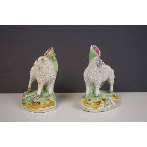 405 - Two 19th century Staffordshire Pastille Burners, two pairs of similar spill holders of sheep and swa... 