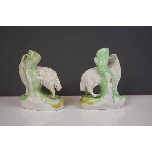 405 - Two 19th century Staffordshire Pastille Burners, two pairs of similar spill holders of sheep and swa... 
