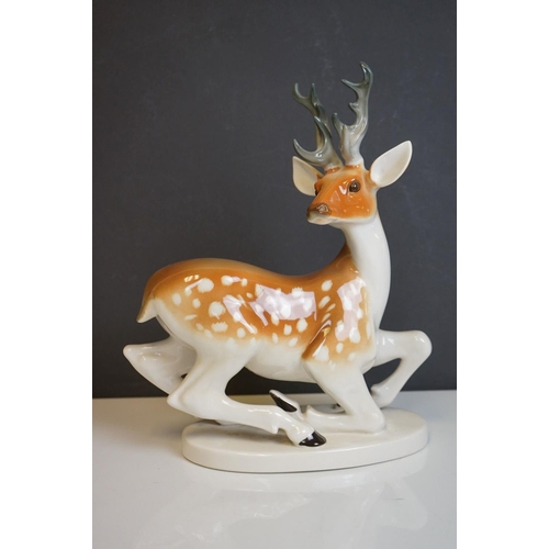 415 - Four Russian Lomonsov figures to include Stag, Tiger Cheetah and Fawn.