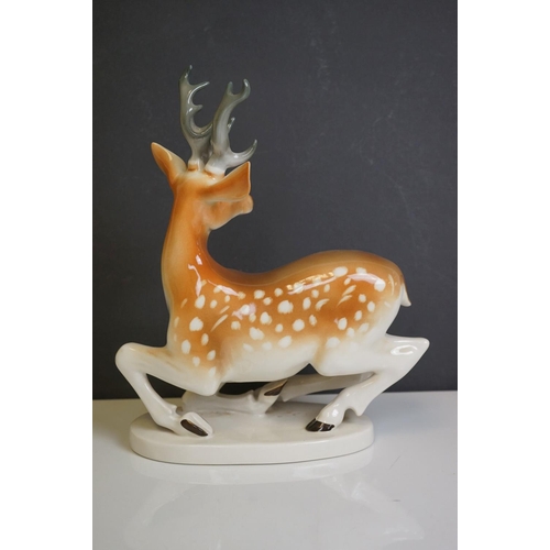 415 - Four Russian Lomonsov figures to include Stag, Tiger Cheetah and Fawn.