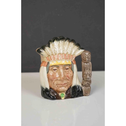 417 - A collection of four Royal Doulton character jugs together with a Royal Doulton toby jug.