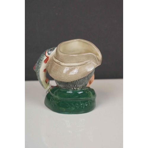 417 - A collection of four Royal Doulton character jugs together with a Royal Doulton toby jug.