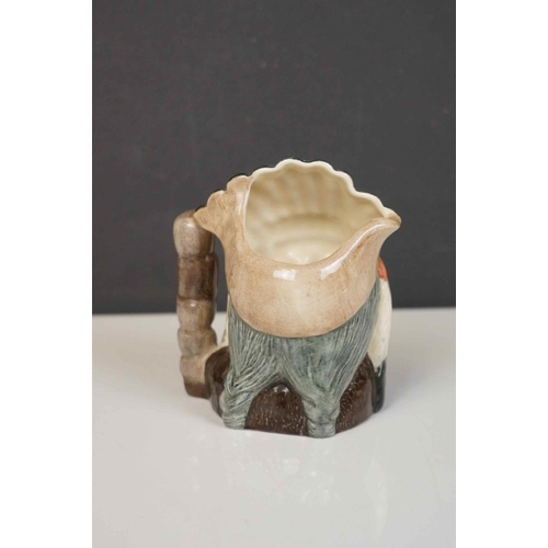 417 - A collection of four Royal Doulton character jugs together with a Royal Doulton toby jug.