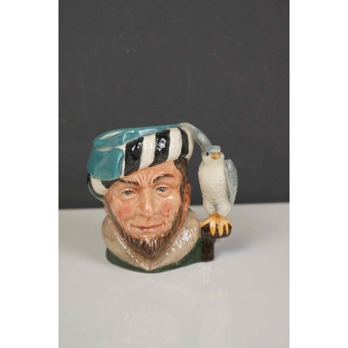 417 - A collection of four Royal Doulton character jugs together with a Royal Doulton toby jug.