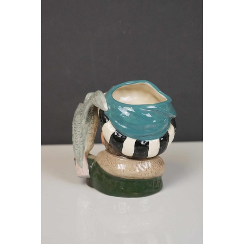 417 - A collection of four Royal Doulton character jugs together with a Royal Doulton toby jug.