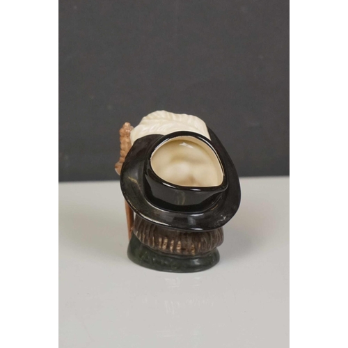 417 - A collection of four Royal Doulton character jugs together with a Royal Doulton toby jug.