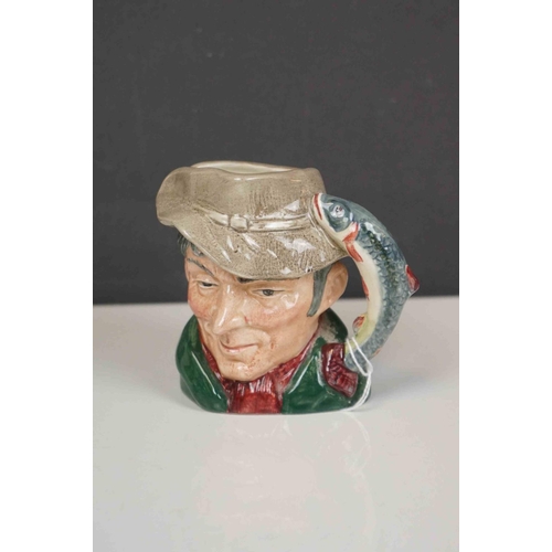 417 - A collection of four Royal Doulton character jugs together with a Royal Doulton toby jug.